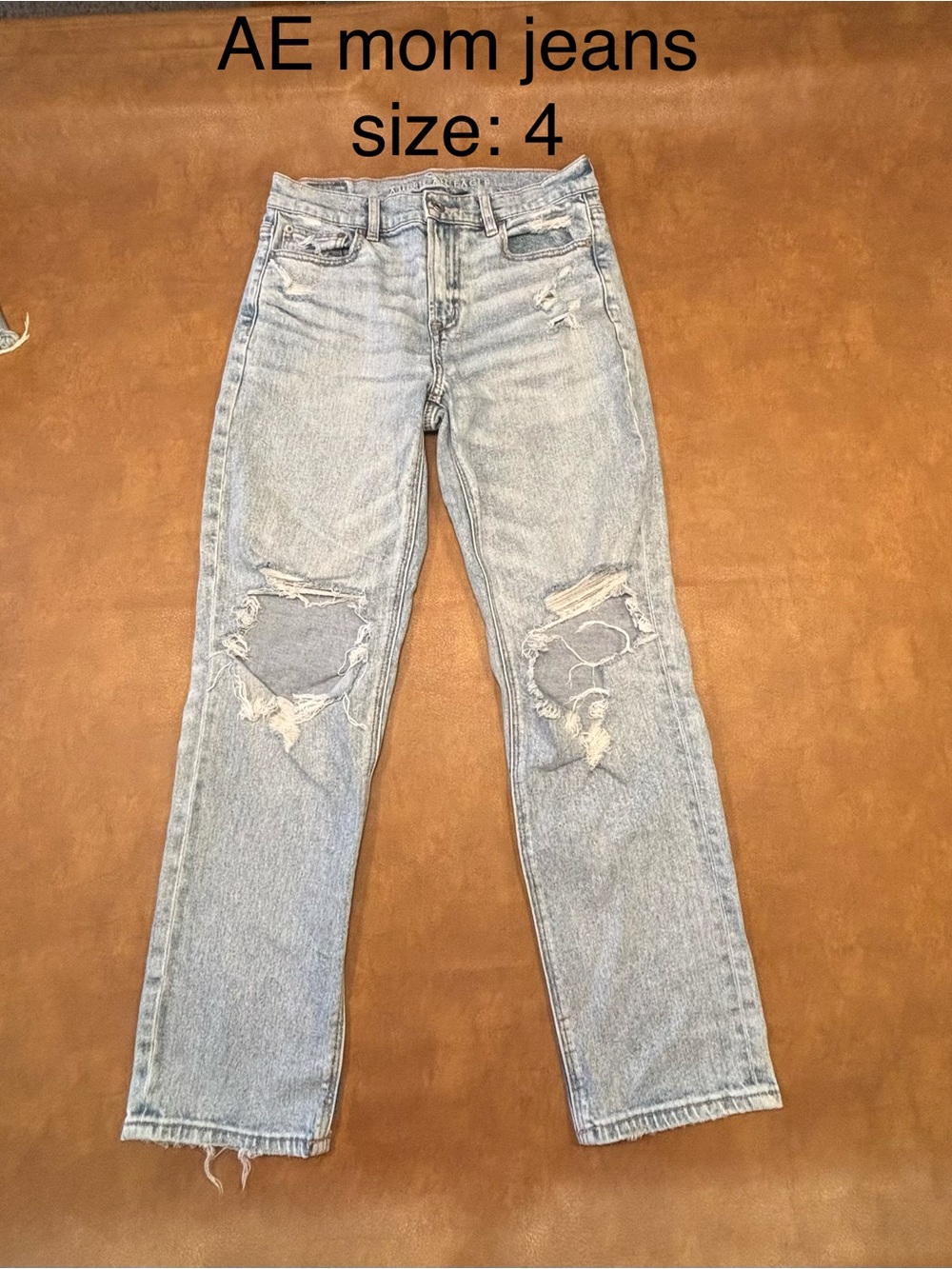 American Eagle Outfitters light blue high-rise mom jeans with knee distressing